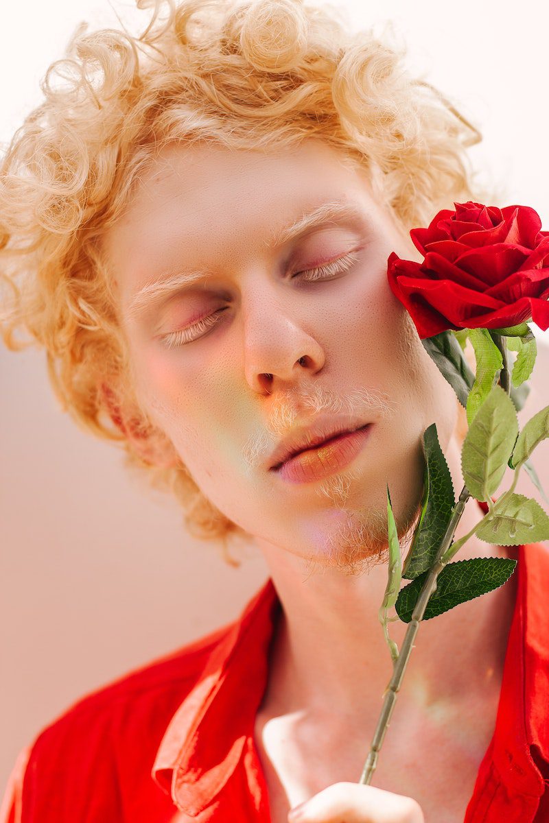 ANYALỊ, albino, Man Wearing Red Collared Shirt Holding Red Rose Flower