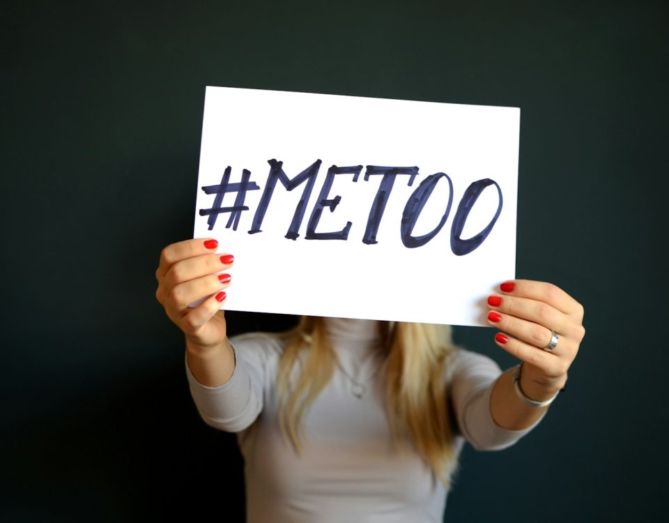 scas, woman holding paper with metoo sign written